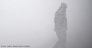Person walks outside during snowstorm